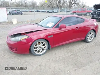 2007 Hyundai Tiburon GT z VIN KMHHN66F67U251509, wystawiony jako IAAI lot #42115300 z przebiegiem 180 334 mil mil oraz . Historia ofert i sprzedaży dostępna na DreamBid. Obrazek 2.