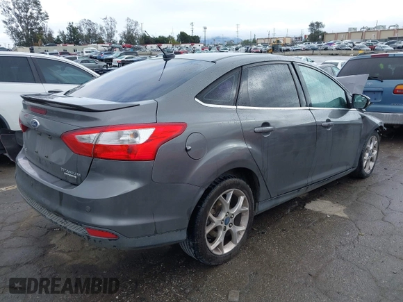 2013 Ford Focus Titanium with VIN 1FADP3J2XDL270393, listed as a IAAI auction lot 41814775 with 76,907 mi miles and . Bid and sale history available at carsss.com. Image 4.