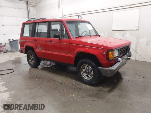 1991 Isuzu Trooper z VIN JACCH58R6M8905869, wystawiony jako IAAI lot #42394651 z przebiegiem 117 130 mil mil oraz . Historia ofert i sprzedaży dostępna na DreamBid. Obrazek 1.