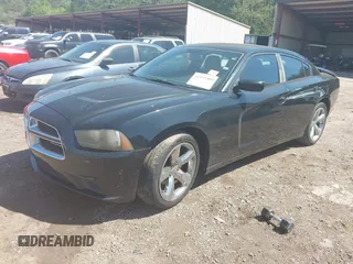 2013 Dodge Charger SE with VIN 2C3CDXBGXDH643384, listed as a IAAI auction lot 41977909 with 124,666 mi miles. Bid and sale history available at carsss.com. Image 2.
