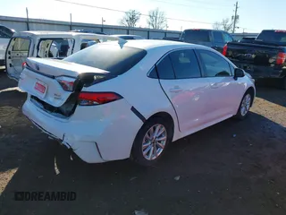 2023 Toyota Corolla Hybrid LE with VIN JTDBCMFE1PJ011085, listed as a IAAI auction lot 41340297 with 34,437 mi miles. Bid and sale history available at carsss.com. Image 4.