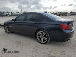 2013 BMW 7 Series 750i with VIN WBAYA8C56DC996704, listed as a Copart auction lot 64466705 with 102,278 mi miles and Salvage title. Bid and sale history available at DreamBid. Image 2.