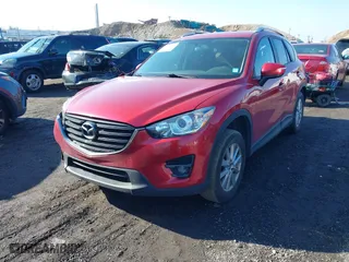 2016 Mazda CX-5 Touring with VIN JM3KE4CY0G0901356, listed as a IAAI auction lot 41641742 with 96,950 mi miles. Bid and sale history available at carsss.com. Image 2.