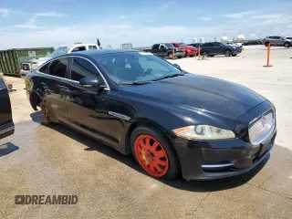 2011 Jaguar XJ with VIN SAJWA1CBXBLV12152, listed as a Copart auction lot 62010855 with 125,697 mi miles and Salvage title. Bid and sale history available at DreamBid. Image 4.