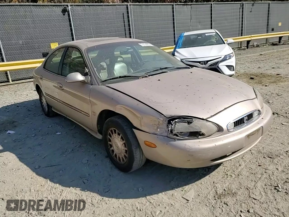 1999 Mercury Sable LS z VIN 1MEFM53S7XG602788, wystawiony jako Copart lot #76894294 z przebiegiem 186 315 mil mil oraz Szkoda całkowita • Salvage title. Historia ofert i sprzedaży dostępna na DreamBid. Obrazek 10.