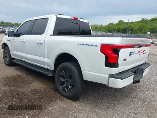 2022 Ford F-150 Lightning Pro with VIN 1FTVW1EL3NWG16132, listed as a IAAI auction lot 42362459 with 16,509 mi miles and . Bid and sale history available at DreamBid. Image 3.
