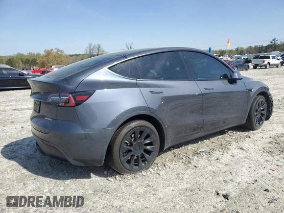 2023 Tesla Model Y Long Range z VIN 7SAYGAEE9PF662103, wystawiony jako Copart lot #51332105 z przebiegiem 35 294 mil mil oraz Szkoda całkowita • Salvage title. Historia ofert i sprzedaży dostępna na DreamBid. Obrazek 3.