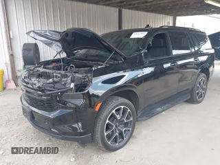 2023 Chevrolet Tahoe RST with VIN 1GNSCRKD2PR531394, listed as a IAAI auction lot 42147801 with 23,423 mi miles and . Bid and sale history available at DreamBid. Image 2.