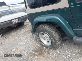 1999 Jeep Wrangler Sahara with VIN 1J4FY49S5XP482037, listed as a IAAI auction lot 42341723 with 161,081 mi miles and . Bid and sale history available at DreamBid. Image 6.