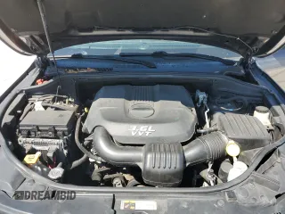 2014 Jeep Grand Cherokee Summit with VIN 1C4RJFJGXEC159438, listed as a Copart auction lot 50864595 with 134,558 mi miles and Salvage title. Bid and sale history available at DreamBid. Image 14.