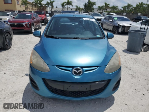 2011 Mazda 2 Sport with VIN JM1DE1HY0B0122590, listed as a Copart auction lot 56162515 with 140,847 mi miles and Clean Title. Bid and sale history available at DreamBid. Image 5.