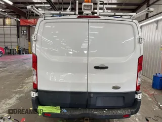 2015 Ford Transit Cargo with VIN 1FTNR1ZM2FKA45204, listed as a IAAI auction lot 42304858 with 137,661 mi miles and . Bid and sale history available at DreamBid. Image 1.