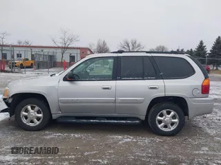 2005 GMC Envoy SLT with VIN 1GKDT13S352258640, listed as a IAAI auction lot 41226997 with 159,665 mi miles. Bid and sale history available at carsss.com. Image 14.