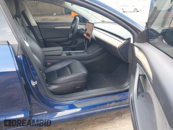 2022 Tesla Model 3 with VIN 5YJ3E1EA7NF188417, listed as a IAAI auction lot 41885623 with 105,457 mi miles and . Bid and sale history available at DreamBid. Image 5.