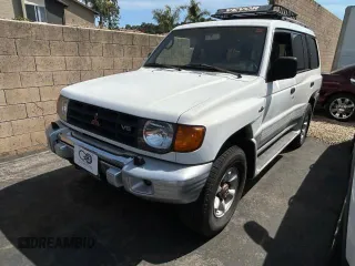 2000 Mitsubishi Montero z VIN JA4MR51R6YJ002305, wystawiony jako Copart lot #50263015 z przebiegiem 138 861 mil mil oraz Czysty tytuł • Clean title. Historia ofert i sprzedaży dostępna na DreamBid. Obrazek 2.