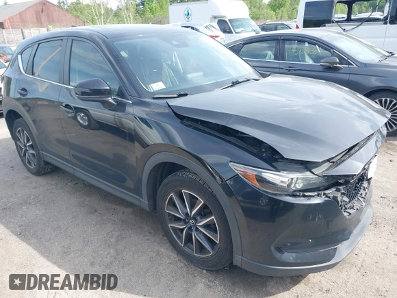 2018 Mazda CX-5 Touring z VIN JM3KFBCM9J0358997, wystawiony jako IAAI lot #42332606 z przebiegiem 93 952 mil mil oraz . Historia ofert i sprzedaży dostępna na DreamBid. Obrazek 1.