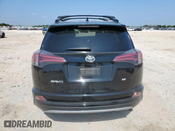 2018 Toyota RAV4 SE with VIN 2T3NFREV6JW436488, listed as a Copart auction lot 60297905 with 74,034 mi miles and Salvage title. Bid and sale history available at DreamBid. Image 6.