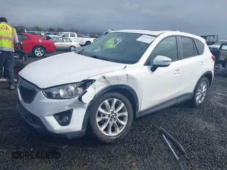 2015 Mazda CX-5 Grand Touring with VIN JM3KE4DY0F0483037, listed as a IAAI auction lot 41578222 with 102,988 mi miles. Bid and sale history available at carsss.com. Image 2.
