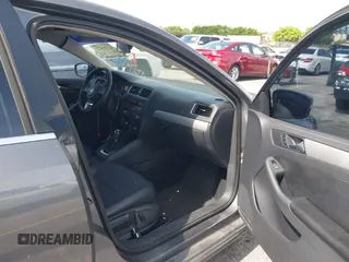 2013 Volkswagen Jetta SE with VIN 3VWDP7AJ1DM280251, listed as a IAAI auction lot 42391472 with 98,788 mi miles and . Bid and sale history available at DreamBid. Image 5.