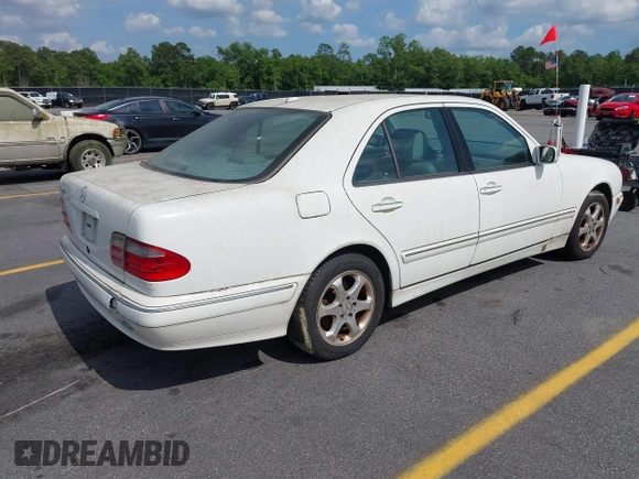 2002 Mercedes-Benz E-Class with VIN WDBJF65J22B432263, listed as a IAAI auction lot 42130545 with 220,852 mi miles. Bid and sale history available at carsss.com. Image 4.