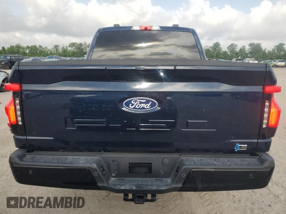 2024 Ford F-150 Lightning Flash with VIN 1FT6W3L7XRWG19735, listed as a Copart auction lot 54361215 with 7,764 mi miles and Salvage Title. Bid and sale history available at DreamBid. Image 6.