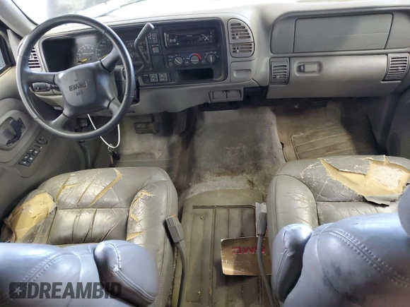 1999 GMC Suburban z VIN 3GKFK16R5XG525338, wystawiony jako Copart lot #58920565 z przebiegiem 212 586 mil mil oraz Szkody całkowita. Historia ofert i sprzedaży dostępna na DreamBid. Obrazek 8.
