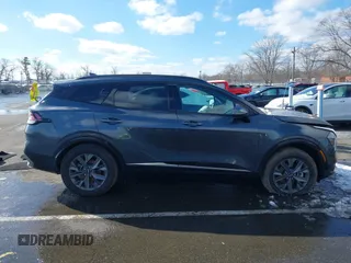 2023 Kia Sportage SX-Prestige with VIN KNDPXCAG5P7038476, listed as a IAAI auction lot 41532005 with 14,151 mi miles and . Bid and sale history available at DreamBid. Image 13.