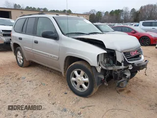 2005 GMC Envoy SLT with VIN 1GKDT13S452263166, listed as a IAAI auction lot 41543466 with 166,999 mi miles. Bid and sale history available at carsss.com. Image 1.