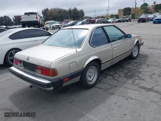 1985 BMW 6 Series 635CSi with VIN WBAEC8400F0610637, listed as a IAAI auction lot 41935412 with 129,943 mi miles. Bid and sale history available at carsss.com. Image 4.