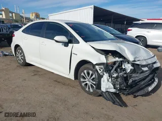 2020 Toyota Corolla Hybrid LE with VIN JTDEBRBE4LJ019579, listed as a IAAI auction lot 42024106 with 59,240 mi miles. Bid and sale history available at carsss.com. Image 1.