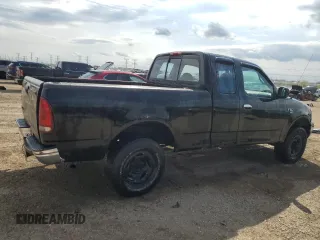 1999 Ford F-150 with VIN 1FTRX18W1XKC00918, listed as a Copart auction lot 53830305 with 205,205 mi miles and Salvage title. Bid and sale history available at DreamBid. Image 3.