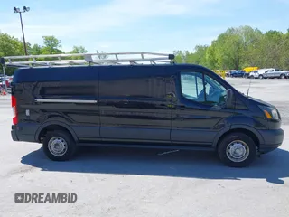 2015 Ford Transit Cargo z VIN 1FTBW2YG7FKA20201, wystawiony jako IAAI lot #42253463 z przebiegiem 83 235 mil mil oraz . Historia ofert i sprzedaży dostępna na DreamBid. Obrazek 13.