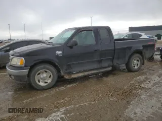 1999 Ford F-150 with VIN 2FTRX17W1XCA75215, listed as a Copart auction lot 49999465 with 312,618 mi miles and Clean Title. Bid and sale history available at DreamBid. Image 1.