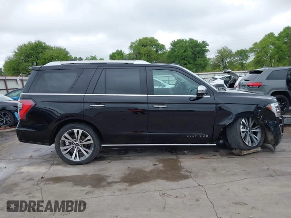 2019 Ford Expedition Platinum with VIN 1FMJU1MT8KEA02325, listed as a IAAI auction lot 41861772 with 77,124 mi miles. Bid and sale history available at carsss.com. Image 14.