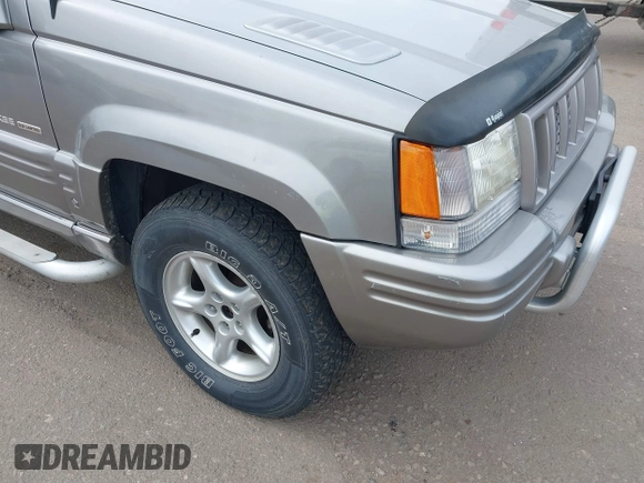 1998 Jeep Grand Cherokee Limited with VIN 1J4GZ88Z6WC307986, listed as a IAAI auction lot 41539972 with 150,652 mi miles. Bid and sale history available at carsss.com. Image 6.