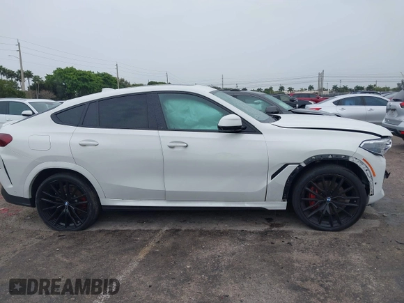 2021 BMW X6 xDrive40i z VIN 5UXCY6C00M9F88215, wystawiony jako IAAI lot #41646498 z przebiegiem 43 587 mil mil oraz . Historia ofert i sprzedaży dostępna na DreamBid. Obrazek 13.