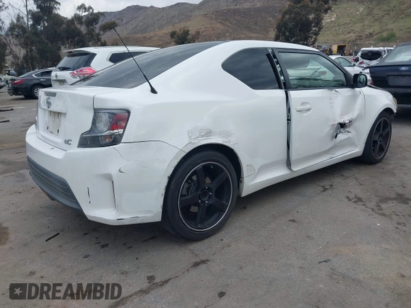 2014 Scion tC with VIN JTKJF5C79E3075707, listed as a IAAI auction lot 41557310 with 132,468 mi miles. Bid and sale history available at carsss.com. Image 4.