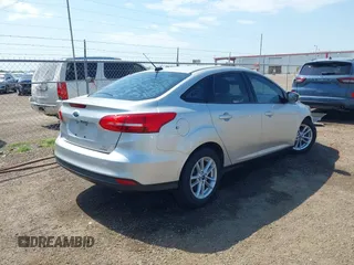 2018 Ford Focus SE z VIN 1FADP3FE0JL321530, wystawiony jako IAAI lot #42275532 z przebiegiem 65 412 mil mil oraz . Historia ofert i sprzedaży dostępna na DreamBid. Obrazek 4.