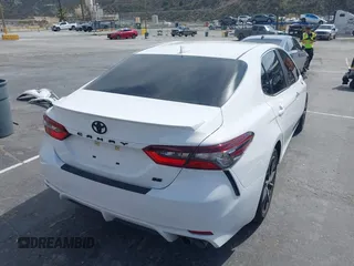 2023 Toyota Camry SE with VIN 4T1G11AK1PU776945, listed as a IAAI auction lot 41744551 with 66,086 mi miles and . Bid and sale history available at carsss.com. Image 4.