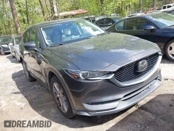 2019 Mazda CX-5 Grand Touring with VIN JM3KFBDM7K0619379, listed as a IAAI auction lot 42007107 with 209,590 mi miles. Bid and sale history available at carsss.com. Image 1.