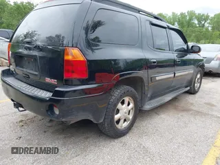 2005 GMC Envoy XL SLE with VIN 1GKET16S156114805, listed as a IAAI auction lot 42163519 with 168,584 mi miles. Bid and sale history available at carsss.com. Image 4.