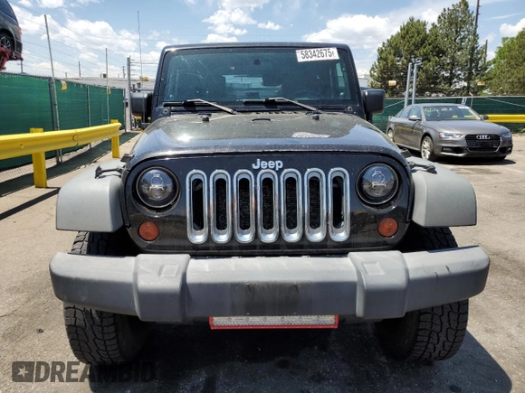 2009 Jeep Wrangler X z VIN 1J4FA24179L716499, wystawiony jako Copart lot #58342675 z przebiegiem 116 871 mil mil oraz Szkoda całkowita • Salvage title. Historia ofert i sprzedaży dostępna na DreamBid. Obrazek 5.