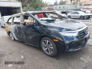 2024 Honda Odyssey Touring with VIN 5FNRL6H86RB001020, listed as a IAAI auction lot 41738645 with Not provided miles and . Bid and sale history available at DreamBid. Image 1.
