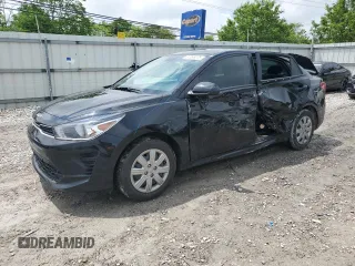 2023 Kia Rio S z VIN 3KPA24AD4PE598103, wystawiony jako Copart lot #57098275 z przebiegiem 34 817 mil mil oraz Szkoda całkowita • Salvage title. Historia ofert i sprzedaży dostępna na DreamBid. Obrazek 1.