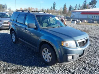 2010 Mazda Tribute Touring with VIN 4F2CY9C73AKM04595, listed as a IAAI auction lot 40797681 with 122,774 mi miles. Bid and sale history available at carsss.com. Image 1.