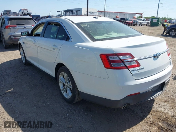2015 Ford Taurus SEL z VIN 1FAHP2E8XFG196270, wystawiony jako IAAI lot #42007068 z przebiegiem 150 093 mil mil oraz . Historia ofert i sprzedaży dostępna na DreamBid. Obrazek 3.