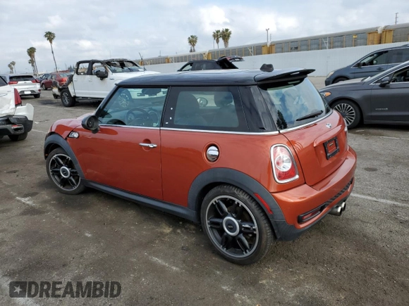 2013 MINI Hardtop S with VIN WMWSV3C57DT477948, listed as a Copart auction lot 54437155 with 63,114 mi miles and Salvage Title. Bid and sale history available at DreamBid. Image 2.