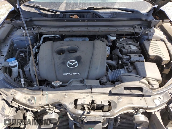 2020 Mazda CX-5 Grand Touring z VIN JM3KFADM4L0794765, wystawiony jako Copart lot #63850005 z przebiegiem 53 270 mil mil oraz Szkoda całkowita • Salvage title. Historia ofert i sprzedaży dostępna na DreamBid. Obrazek 12.