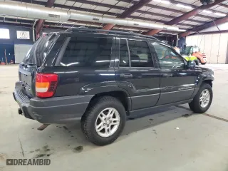 2003 Jeep Grand Cherokee Laredo with VIN 1J4GW48S23C613471, listed as a Copart auction lot 49521865 with 189,918 mi miles and Salvage Title. Bid and sale history available at carsss.com. Image 3.