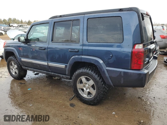 2010 Jeep Commander Sport with VIN 1J4RG4GK5AC119433, listed as a Copart auction lot 87657265 with 212,973 mi miles and Salvage title. Bid and sale history available at DreamBid. Image 2.